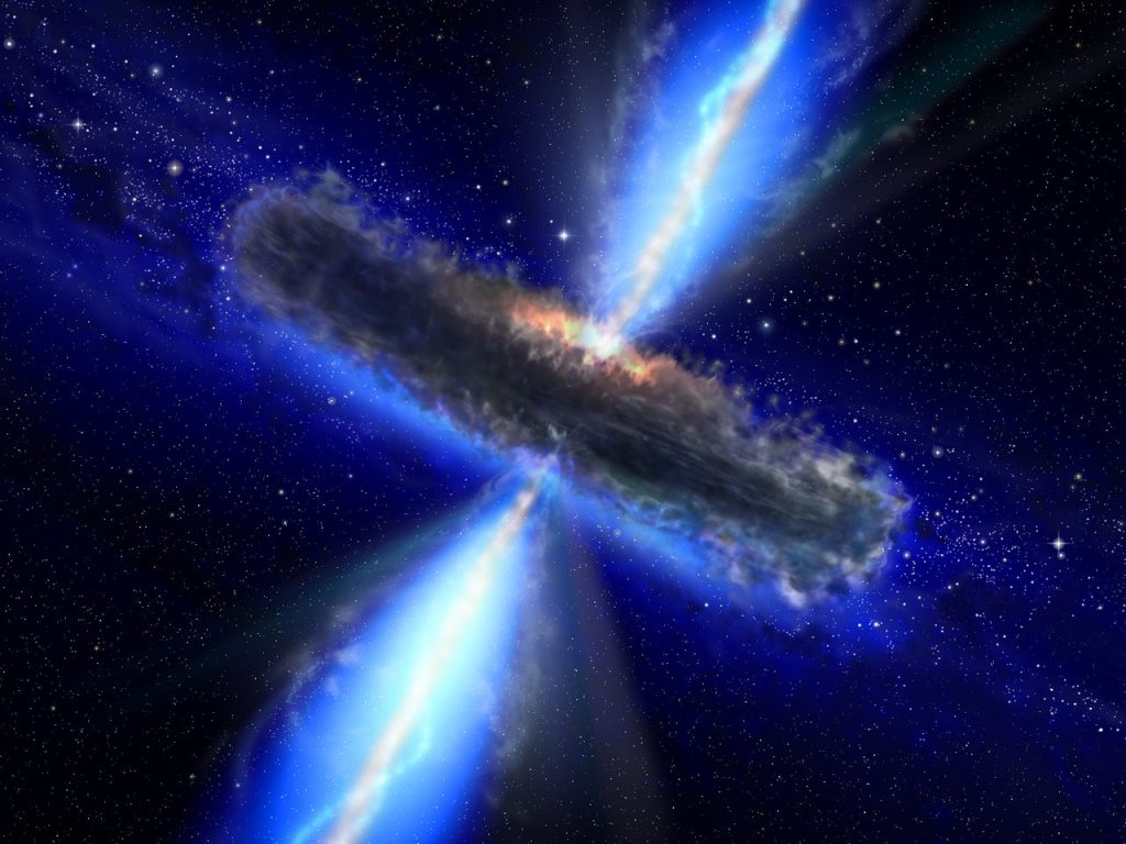 Superhmotná černá díra obklopená diskem hmoty vyzařuje vysokoenergetické záření z tzv. jetů. Umělecká představa: ESO.